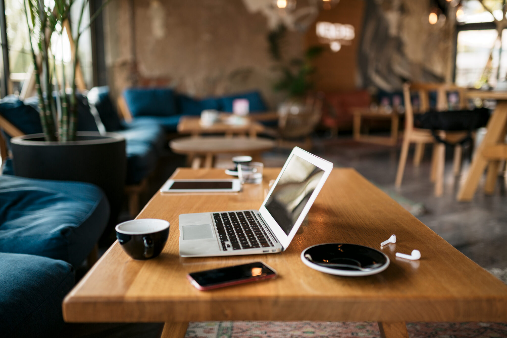 Freelancer's office with a laptop, smart phone, coffee and everything  essential and needed for a freelance online internet job and work