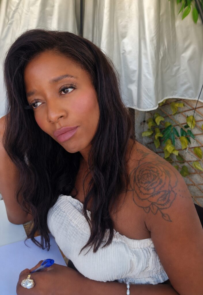 Melanie Martin looking confidently as she ponders strategies for the week