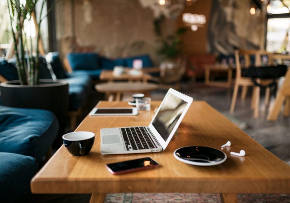 Freelancer's office with a laptop, smart phone, coffee and everything  essential and needed for a freelance online internet job and work