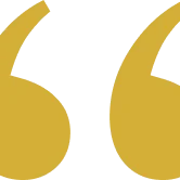 Golden quote marks on black background